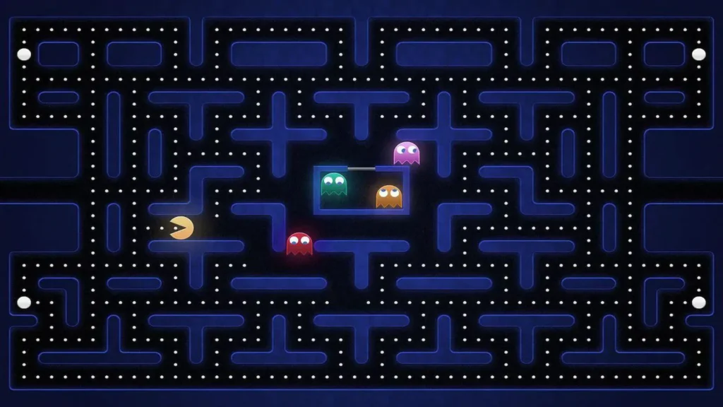 Los Recreativos de mi pueblo – Análisis de Pacman 3 Aquí vemos al Comecocos huir de 4 fantasmas de colores en un fondo negro separado por barreras azules. Captura para el Análisis de Pacman.