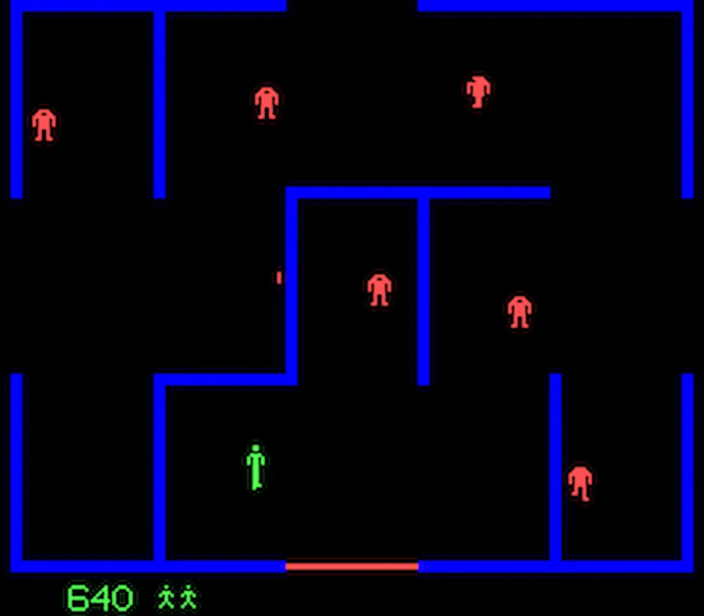 Escena jugable de Castle Wolfenstein con personaje verde esquivando enemigos rojos en un laberinto azul.