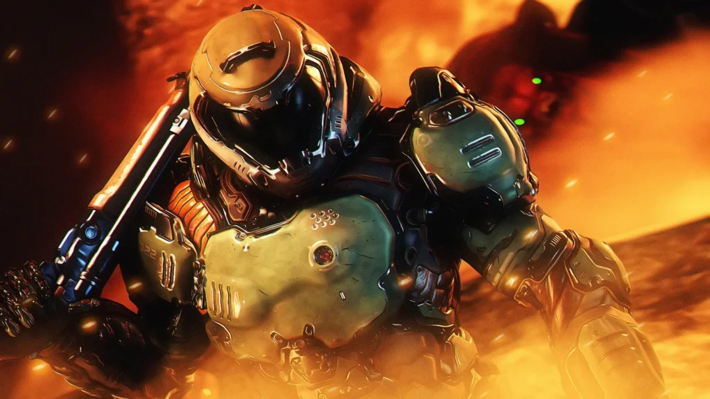 El Doom Slayer de Doom (2016) sostiene su escopeta sobre el hombro mientras avanza entre llamas y un entorno infernal ardiente.