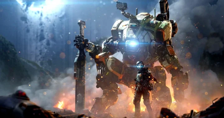 BT y el protagonista de Titanfall 2 posando entre llamas en una cueva iluminada.