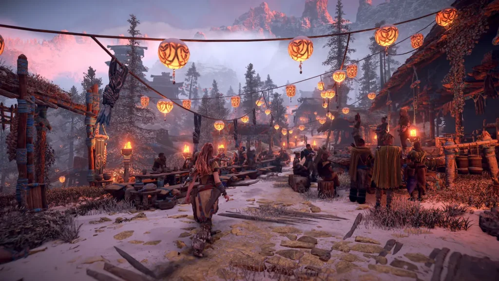 Aloy camina a través de un pueblo tribal cubierto de nieve, donde linternas naranjas iluminan la celebración de un festival en Horizon Zero Dawn.