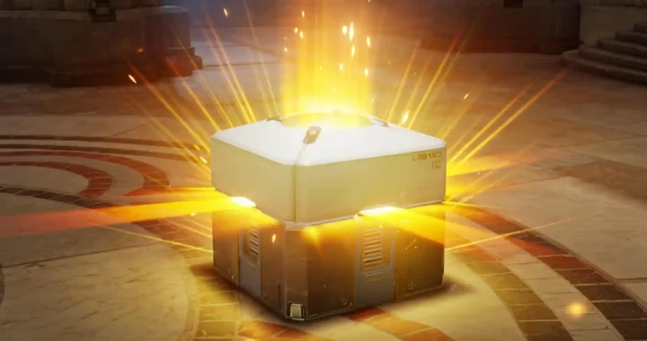 Caja de botín dorada abriéndose con destellos, símbolo visual de los micropagos en los videojuegos de hoy.