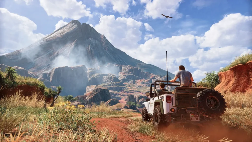 Nathan Drake y Sully conducen un jeep 4x4 hacia un volcán en el paisaje de Madagascar de Uncharted 4.