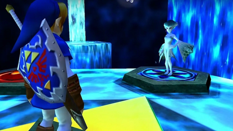 El Ocarina of Time es woke: reinterpretación de un clásico 2 Un Link adulto en la sala de los sabios enfrente a Ruto, la mujer pez. La sala tiene tonos azulados que la envuelven en un halo místico.