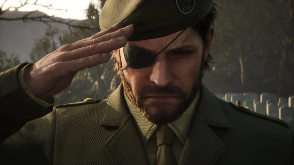 Big Boss rinde homenaje con un saludo militar en un cementerio en el análisis de Metal Gear Solid: Delta.