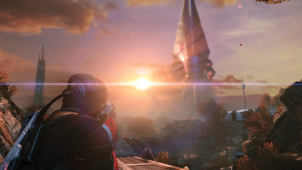 El Comandante Shepard apunta con su rifle a una enorme nave Reaper que se alza sobre un paisaje alienígena en el atardecer, un videojuegos de antes.