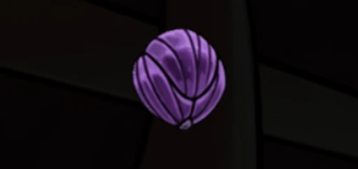 Primer plano de uno de los corazones de pólipo, un objeto púrpura y segmentado que flota en la oscuridad como coleccionable.