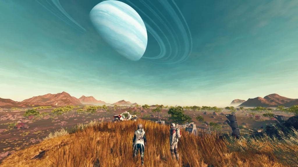 Dos astronautas contemplando el paisaje alienígena de Starfield con un planeta anillado dominando el cielo.